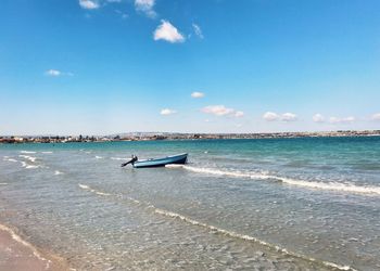 Man on beach against sky