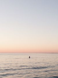 Scenic view of sea against clear sky during sunset