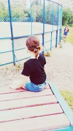 Girl playing on slide at playground