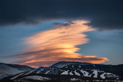 A massive orange cloud towers above winter park ski resort in colorado