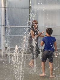 Children playing on water