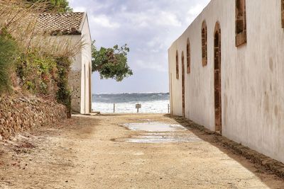 Scenic view of beach by sea against sky