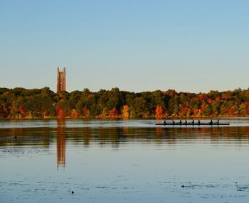 Calm lake against clear sky