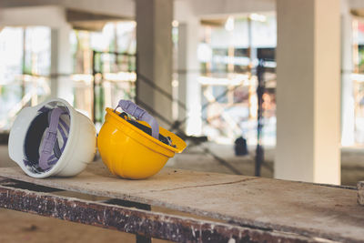 Hardhats on table in old building