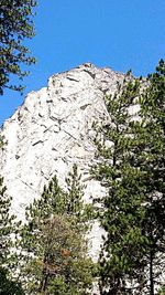 Scenic view of mountains against clear blue sky