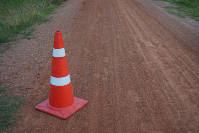 High angle view of red arrow symbol on road