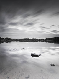 Scenic view of frozen lake against sky