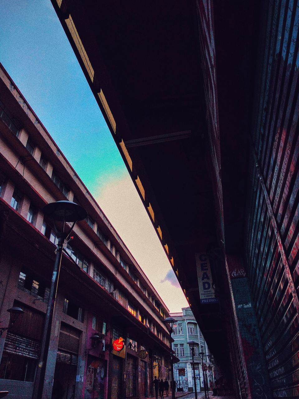 architecture, building exterior, built structure, low angle view, city, sky, building, no people, communication, illuminated, clear sky, text, sign, street, nature, outdoors, day, residential district, transportation, ceiling