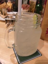 Close-up of drink in glass jar on table