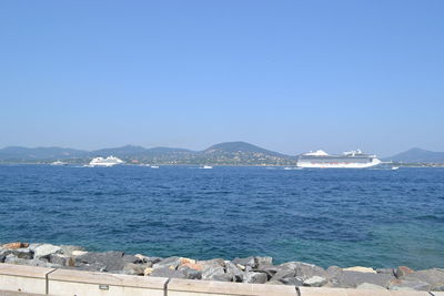 Scenic view of sea against clear blue sky
