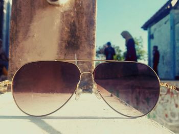 Close-up of sunglasses on glass building