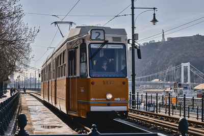 Train at railroad station against sky