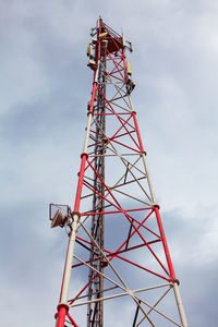 Low angle view of communications tower against sky