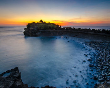 Scenic view of sea against sky during sunset