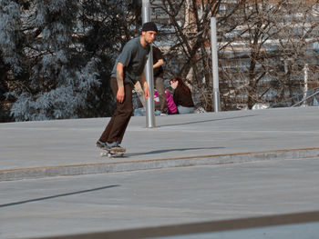 Full length of man skateboarding on snow