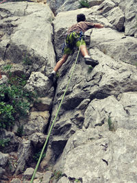 Full length of woman standing on rock