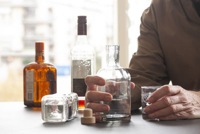 Close-up of wine bottles on table