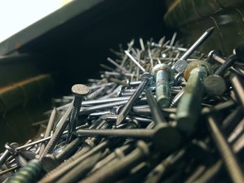 Close-up of nails in container