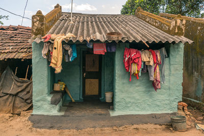 Clothes drying on clothesline outside house