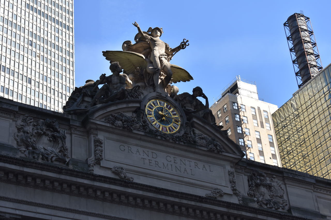 LOW ANGLE VIEW OF STATUE IN CITY