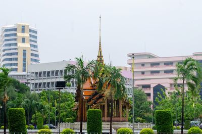 View of buildings in city against clear sky