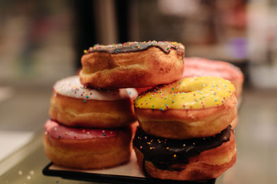 Colorful sweet freshly baked donuts with creamy topping