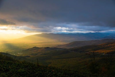 Scenic view of mountains against sky during sunset