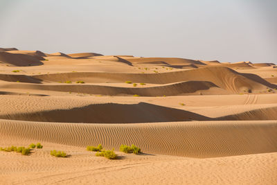 Scenic view of desert against clear sky