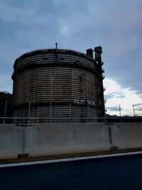 Low angle view of factory against sky