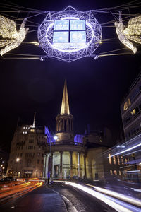 Low angle view of illuminated building at night