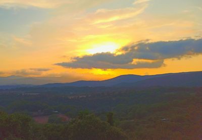 Scenic view of mountains against sky during sunset