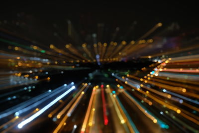 Light trails on road in city at night