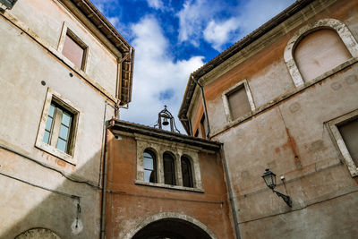 Low angle view of old building against sky