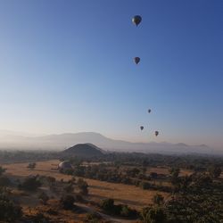 Aerial view of hot air balloon flying in sky