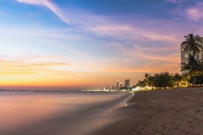 Scenic view of beach against sky during sunset