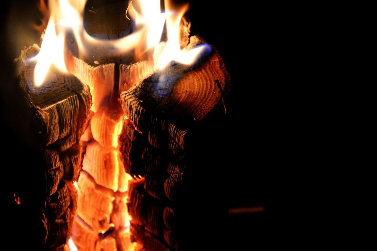 night, burning, flame, fire - natural phenomenon, heat - temperature, glowing, illuminated, dark, close-up, fire, orange color, no people, wood - material, bonfire, outdoors, black background, firewood, light - natural phenomenon, spooky