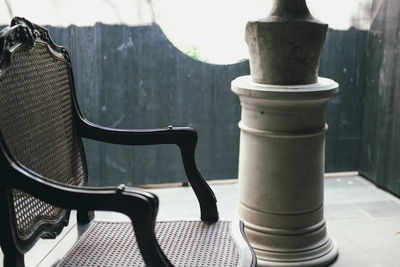 Close-up of empty chairs on table