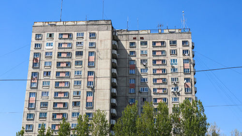 Low angle view of building against blue sky