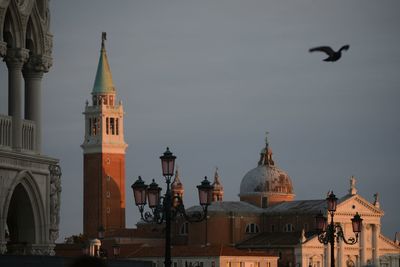 View of buildings in city against sky