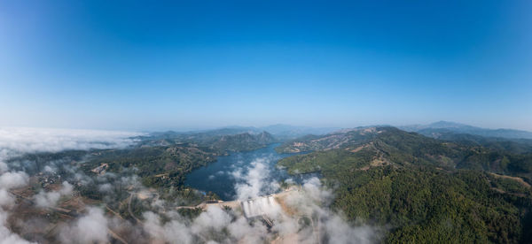 Beautiful panoramic landscape aerial view mae suai dam or reservoir and fog with blue sky background 