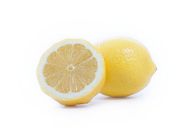 Close-up of lemon slice against white background