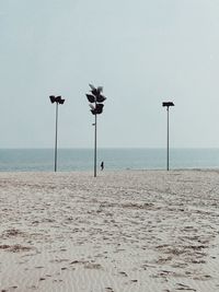 Scenic view of beach against clear sky