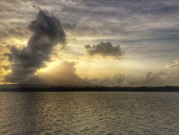 Scenic view of sea against cloudy sky