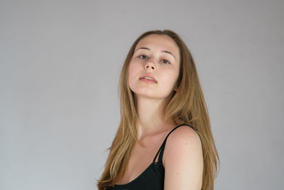 Portrait of a beautiful young woman over white background