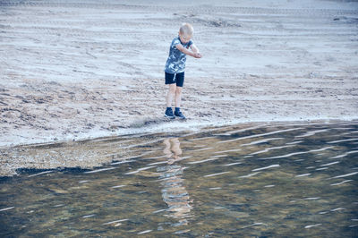 Full length of boy on beach