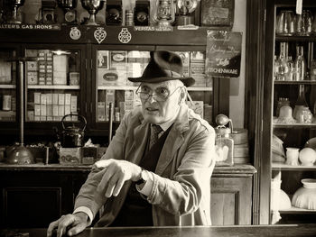 Portrait of man sitting in store