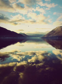 Scenic view of lake against sky during sunset