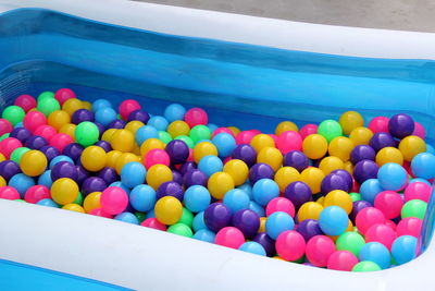 High angle view of multi colored balls in swimming pool