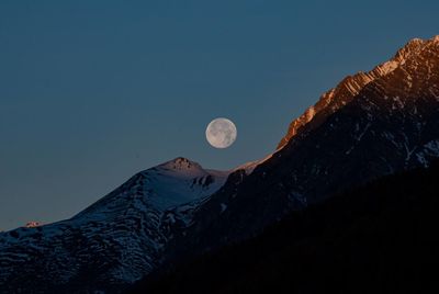 Scenic view of mountains with full moon