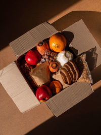 Healthy food delivery harsh shadow. take away products package donation box online shopping delivery